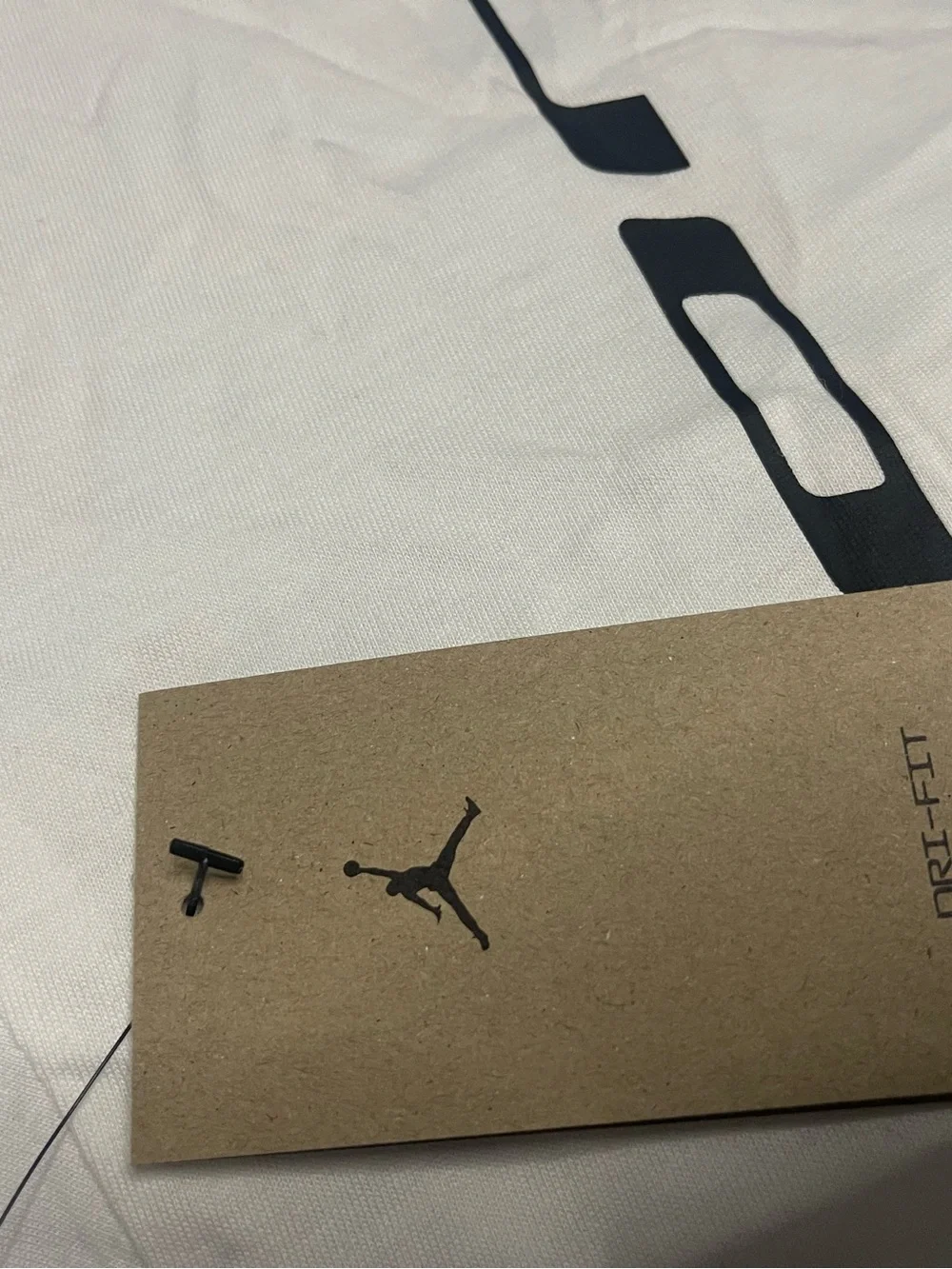 Jordan White Short Sleeve Tee with Black Vertical Logo and Red Jumpman